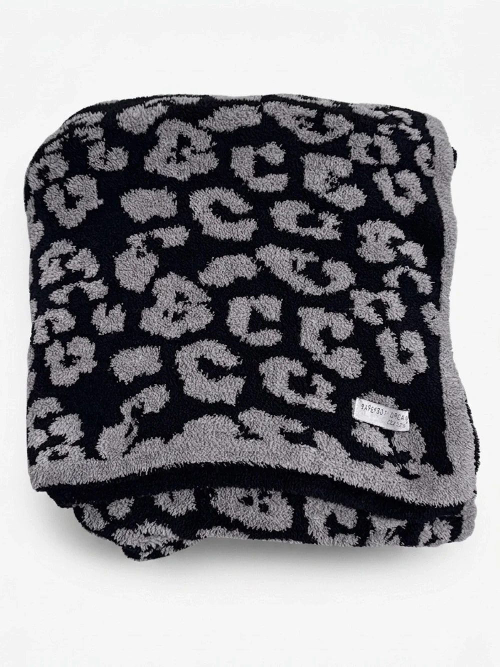 Barefoot Dreams CozyChic Barefoot in the Wild Throw Blanket in Charcoal Leopard